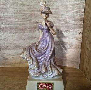 Coca Cola Lavender and Gold Porcelain Lady Figurine